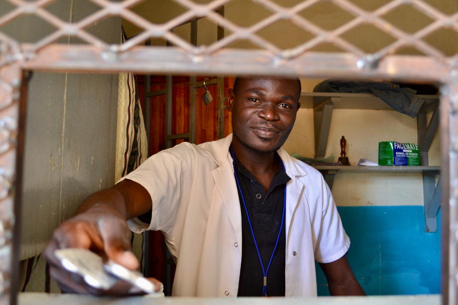 A pharmacist at a rural clinic in Blantyre, Malawi dispensing medications.